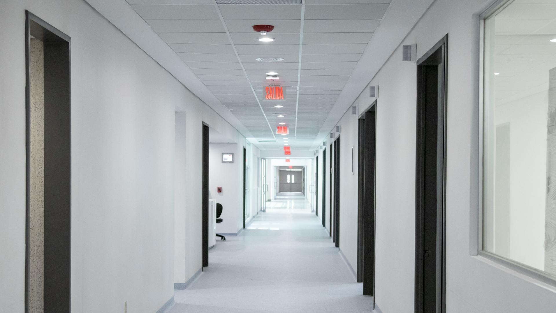 Clean hospital corridor with medical cleaning equipment