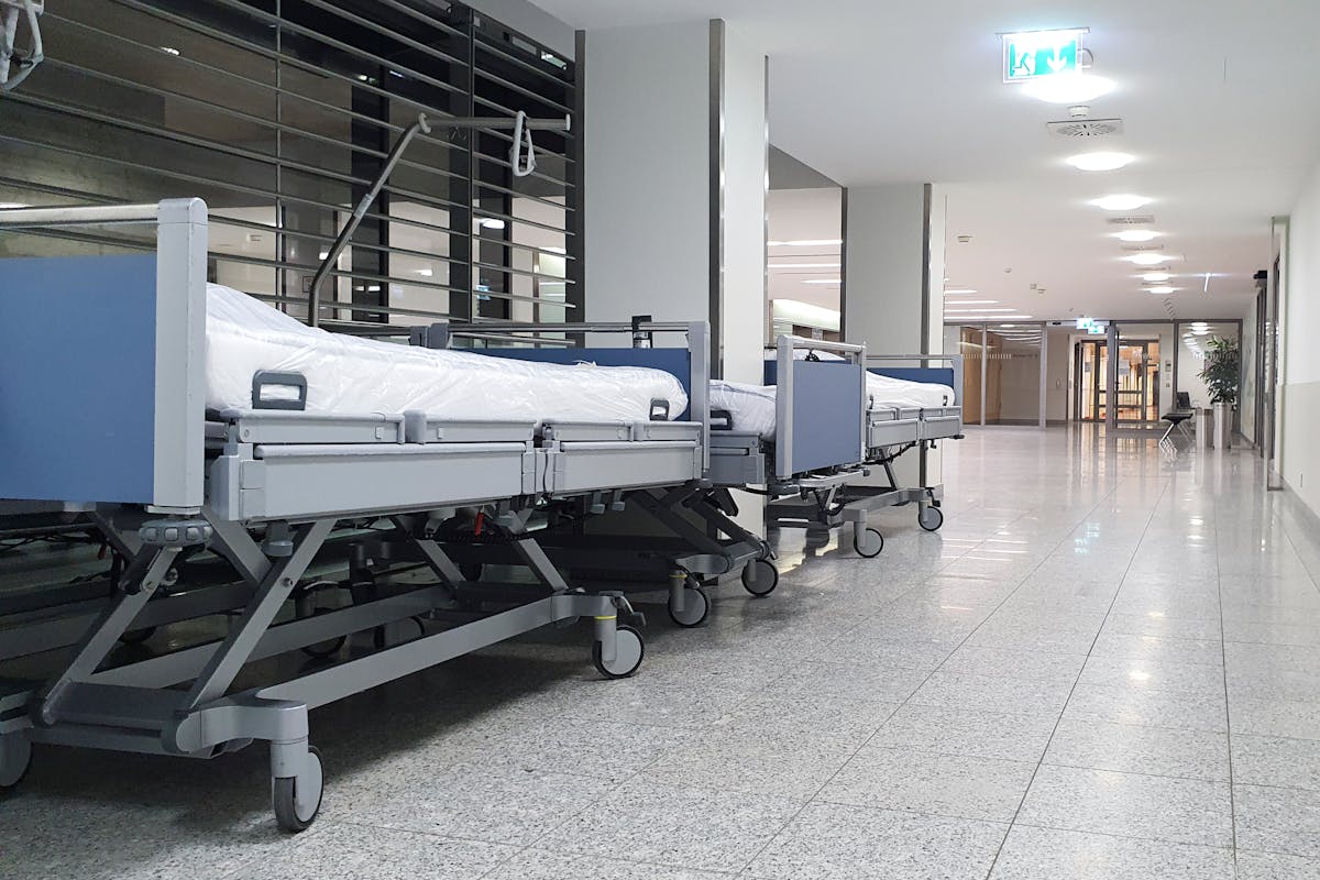 Hospital corridor with cleaning supplies and equipment